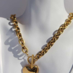 Stylish chunky gold plated stainless steel necklace featuring a heart charm