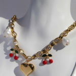 Stylish chunky gold plated stainless steel necklace featuring unique charms