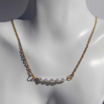 Stylish gold plated stainless steel necklace featuring freshwater pearls