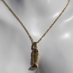 Stylish gold plated stainless steel necklace featuring fish