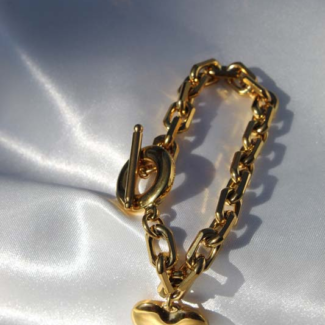 Gold plated stainless steel bracelet with charm.