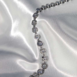 Stainless steel bracelet and zircons.