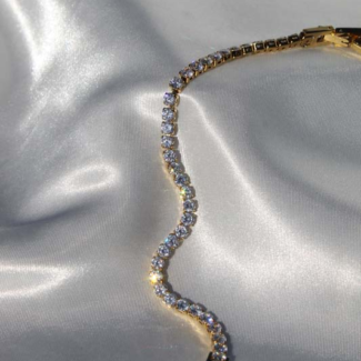 Gold plated stainless steel bracelet and zircons.