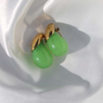 Gold plated stainless steel earrings with a drop shape semiprecious gem.