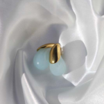 Gold plated stainless steel earrings with a drop shape semiprecious gem.
